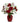 Red roses, white lilies, and daisies in a red vase.